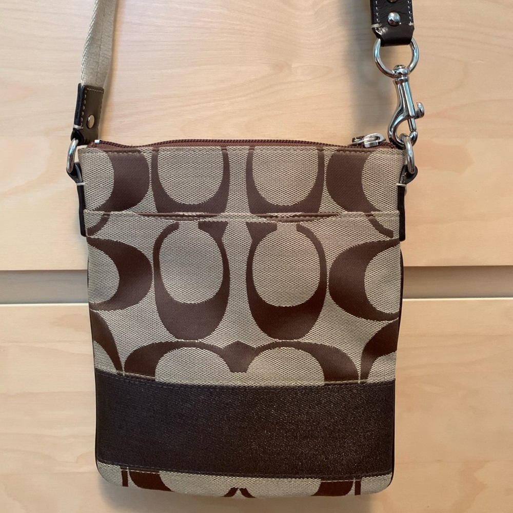 The Coach Signature Collection crossbody bag.